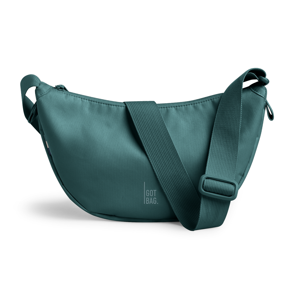 MOON BAG Tasche in sea teal (kühles Türkisgrün) als Studioaufnahme in Frontansicht.